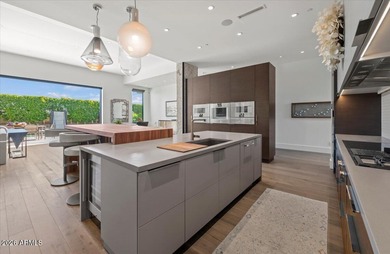 Located within a guard-gated enclave, this Paradise Valley