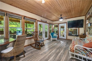Nestled within the exclusive gated Lake Rhodhiss community of - photo 17