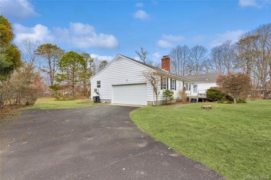 Located in the Rampasture Point section of Hampton Bays, this - photo 2