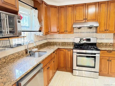 a well-maintained brick townhouse. This residence offers a solid - photo 3