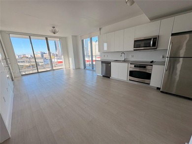 Bright corner unit at The Ivy Condominium featuring