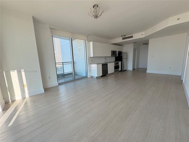 Bright corner unit at The Ivy Condominium featuring