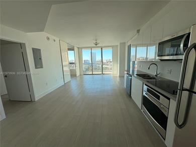 Bright corner unit at The Ivy Condominium featuring