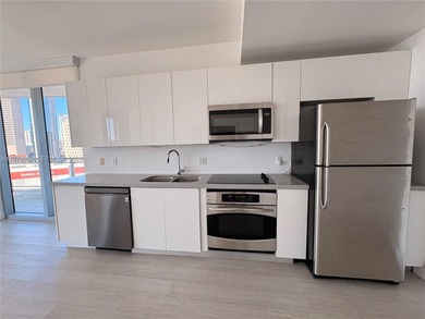 Bright corner unit at The Ivy Condominium featuring