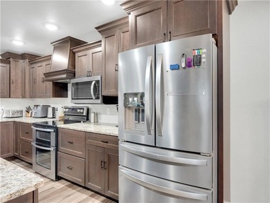 This expansive residence in Warsaw, MO, offers a harmonious - photo 21