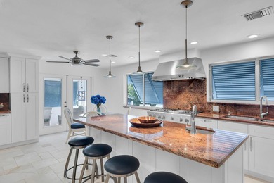Welcome to this spacious canal-front retreat set on an oversized - photo 21