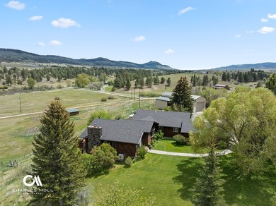 Set against 10+ acres with sweeping Montana views, this - photo 1