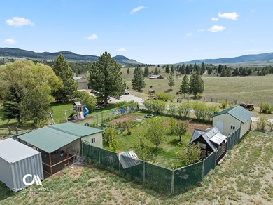 Set against 10+ acres with sweeping Montana views, this - photo 9
