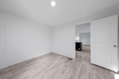 CONVENIENTLY LOCATED, COZY AND AFFORDABLE NEW HOME. Featuring an - photo 22