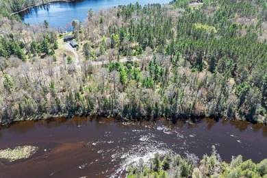 This 1.16-acre wooded parcel with 210 feet of frontage on the - photo 24