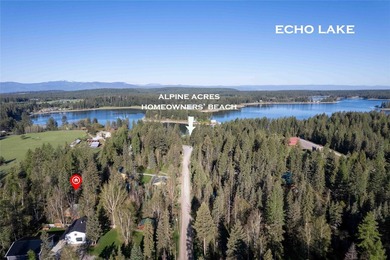 Nestled on a private, wooded .5-acre lot, this chalet-style home - photo 3