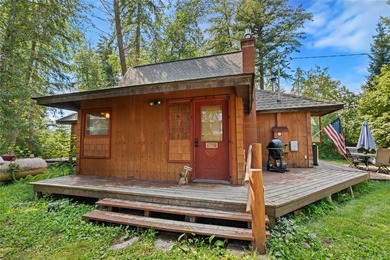 Nestled on a private, wooded .5-acre lot, this chalet-style home - photo 4