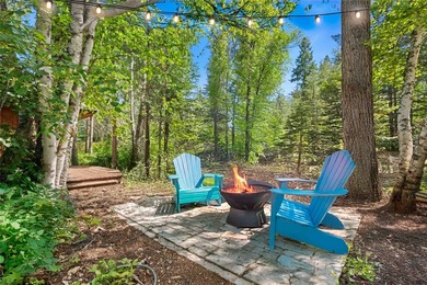 Nestled on a private, wooded .5-acre lot, this chalet-style home - photo 5