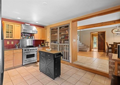 Nestled on a private, wooded .5-acre lot, this chalet-style home - photo 6