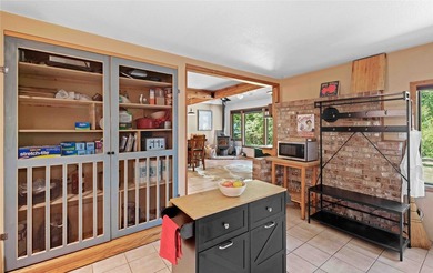 Nestled on a private, wooded .5-acre lot, this chalet-style home - photo 8