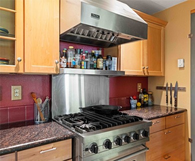 Nestled on a private, wooded .5-acre lot, this chalet-style home - photo 10