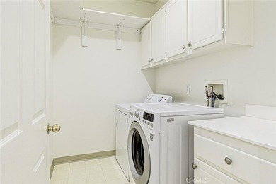 RARE DUAL PRIMARY LAYOUT! Welcome to effortless luxury living in - photo 14