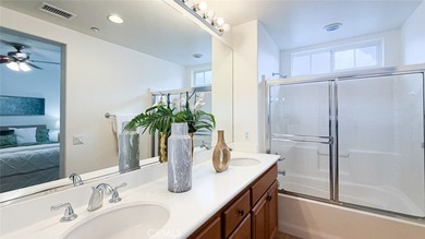 RARE DUAL PRIMARY LAYOUT! Welcome to effortless luxury living in - photo 21