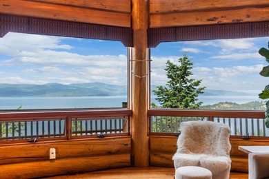 Located at the end of the road, this custom log home is perched - photo 4