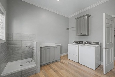 Step into this custom English-inspired one-level home, nestled - photo 44