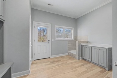Step into this custom English-inspired one-level home, nestled - photo 47