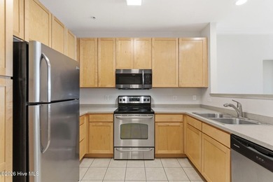 Perched on the top floor as a desirable corner end unit, this 3 - photo 11