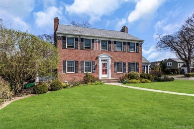 Welcome to this beautifully maintained brick Center Hall - photo 2