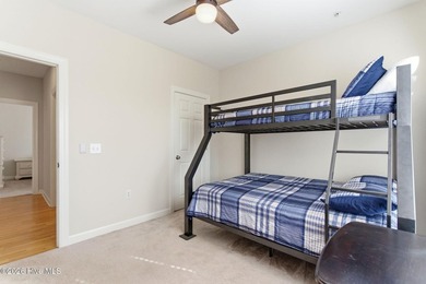 Perched on the top floor as a desirable corner end unit, this 3 - photo 34