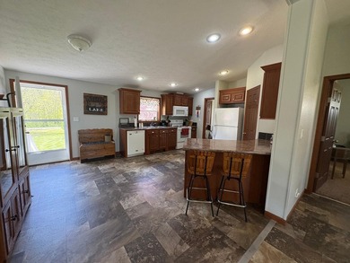 Nestled on 1.5 beautifully maintained acres, this charming 2 - photo 7
