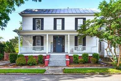 Step into the charm and character of downtown living in this - photo 1
