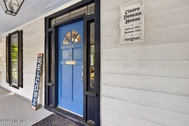 Step into the charm and character of downtown living in this - photo 3