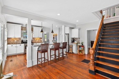 Step into the charm and character of downtown living in this - photo 6