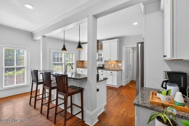 Step into the charm and character of downtown living in this - photo 7