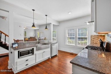 Step into the charm and character of downtown living in this - photo 8