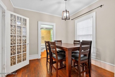 Step into the charm and character of downtown living in this - photo 9