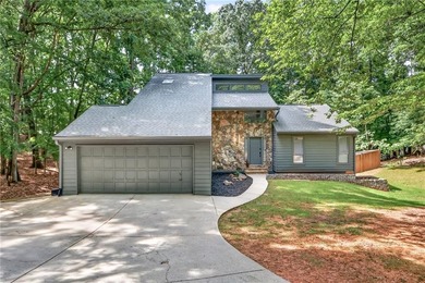 Tucked away on nearly an acre in the highly sought-after - photo 1