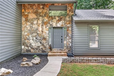 Tucked away on nearly an acre in the highly sought-after - photo 2