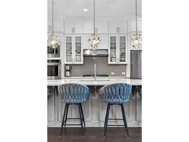 Experience elevated townhome living in the prestigious Gates at