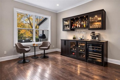 Experience elevated townhome living in the prestigious Gates at