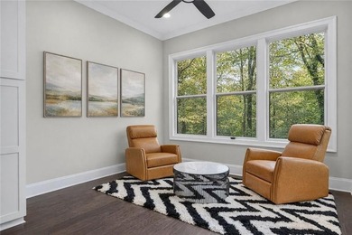 Experience elevated townhome living in the prestigious Gates at