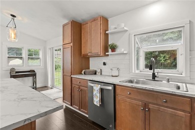 Tucked away in a peaceful setting, this three-bedroom - photo 13