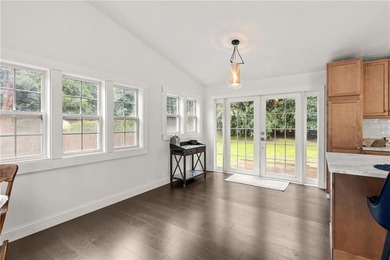 Tucked away in a peaceful setting, this three-bedroom - photo 16