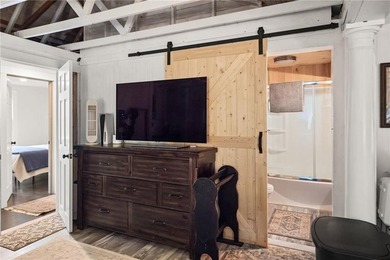 Tucked away in a peaceful setting, this three-bedroom - photo 26