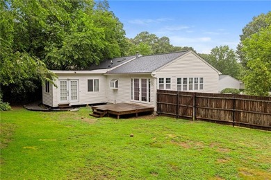 Tucked away in a peaceful setting, this three-bedroom - photo 44