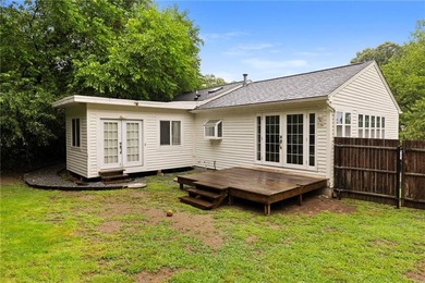 Tucked away in a peaceful setting, this three-bedroom - photo 46