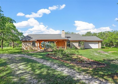 Introducing a lakeside retreat nestled on 3.891 acres & boasting - Lake Home For Sale in Palo Pinto, Texas