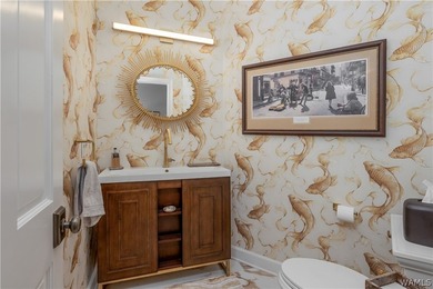 Nestled on a private 2.41-acre lot with an additional 1.51-acre