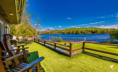 Set along the shoreline of Lower Saranac Lake within the - photo 13