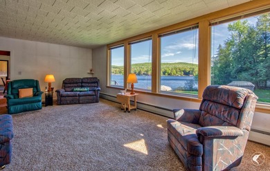 Set along the shoreline of Lower Saranac Lake within the - photo 19