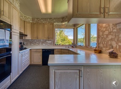 Set along the shoreline of Lower Saranac Lake within the - photo 20